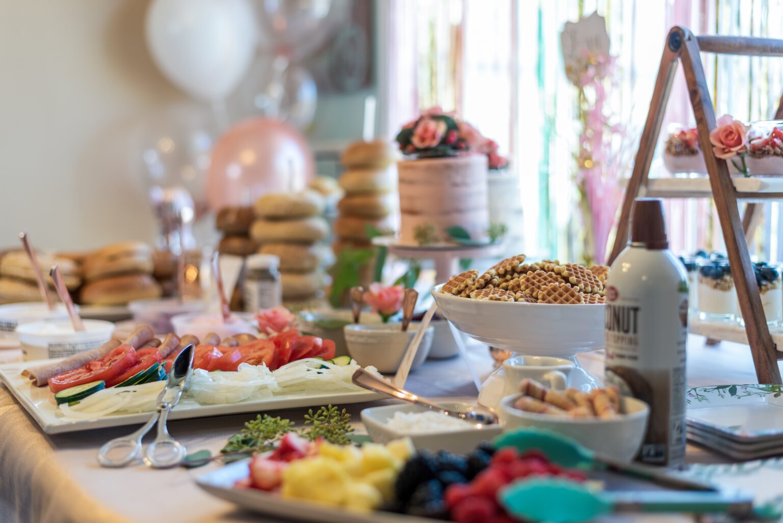 closeup of desserts and brunch food on table at wedding shower