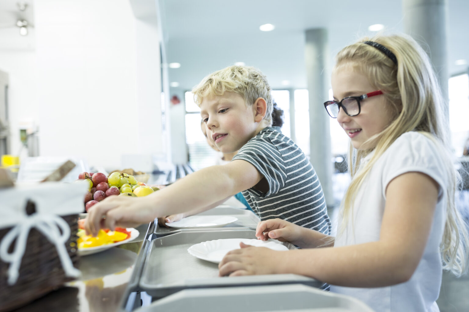 Pupils at counter in school canteen